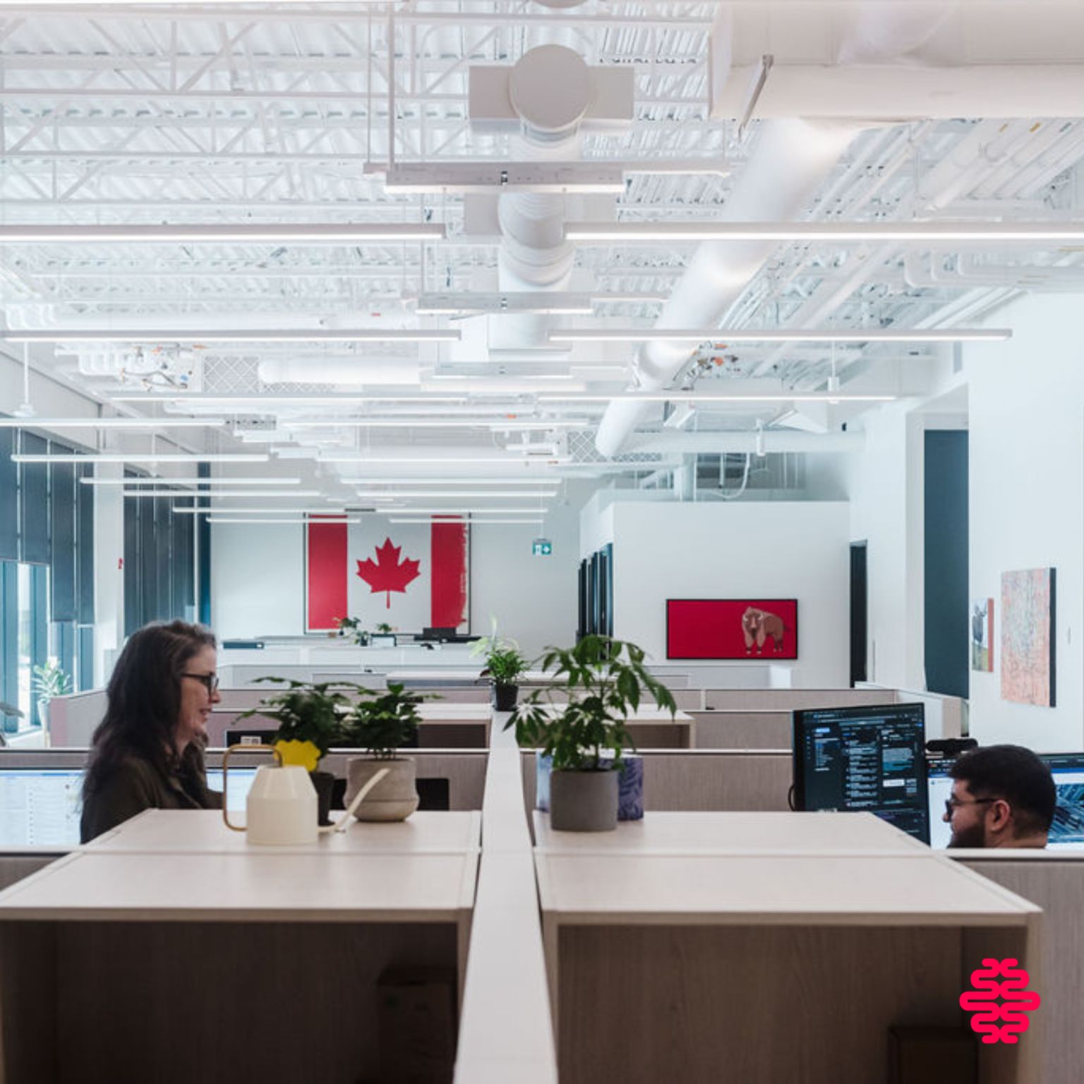 We Know Training Edmonton HQ, open workspace with Canadian flag